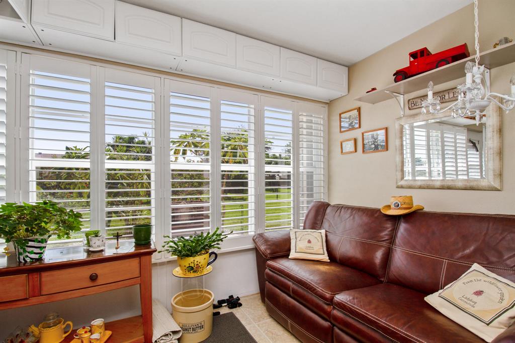 Located less than 4 miles from the beach,and the famous ''Downtown Delray'', this spacious light and bright 1 bedroom 1.5 bathroom villa WITH A DEN that is large enough to be a 2nd bedroom. IMPACT GLASS and SHUTTERS throughout as well as plantation shutters on all windows! Two walk-in closets in the master bedroom. this villa features a new electrical panel, AC 2013, water heater 2016. Enjoy the beautiful laminate and tile floors throughout and your very own washer and dryer right in the unit! Maintenance fee of only $321 includes water, sewer, cable, lawn and roof maintenance, exterior paint and insurance and all of the amenities such pool, tennis, bocce ball, etc. Community features STRONG RESERVES and roofs were replaced in 2019 at no cost to the owners! Service Animals are welcome