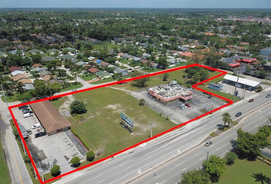 3.60± Acre Income-Producing Commercial Development Site. This opportunity features an operating restaurant with additional income from a lucrative billboard. Located directly to the south is a 100% leased, multi-tenant office building with short-term leases. The property offers maximum flexibility for retail, restaurant, drugstore, department store, professional office, medical/dental office, and more. With easy access to Lake Worth Rd, I-95, and Florida's Turnpike, this development opportunity is centrally located in a heavy traffic area (40,000 AADT). Please do not disturb or speak with any tenants. Call Rob Hamman.