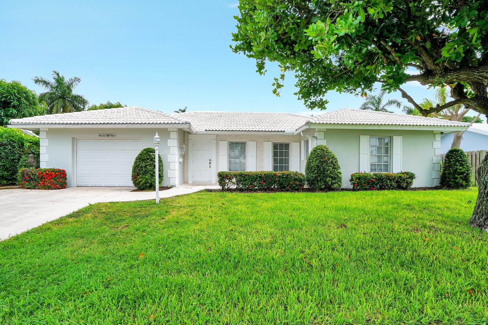 Welcome to this charming home in Boca Square, featuring two bedrooms and two bathrooms, and boasting a one-car garage along with a spacious backyard. Step out onto the screened-in back patio through the sliders and relish the delightful evening breeze. The home offers a modern touch with all newer stainless steel appliances, a new AC system, window blinds thru-out, and abundant natural light. The backyard has been updated with fresh sod, providing a lush and inviting outdoor space. Situated in East Boca Raton, this property falls within an excellent school district and is just minutes away from the beautiful beaches, Downtown Boca, Mizner, shopping centers, & convenient commuting options. The neighborhood showcases superb walkability, making strolls to local stores/restaurants easy access