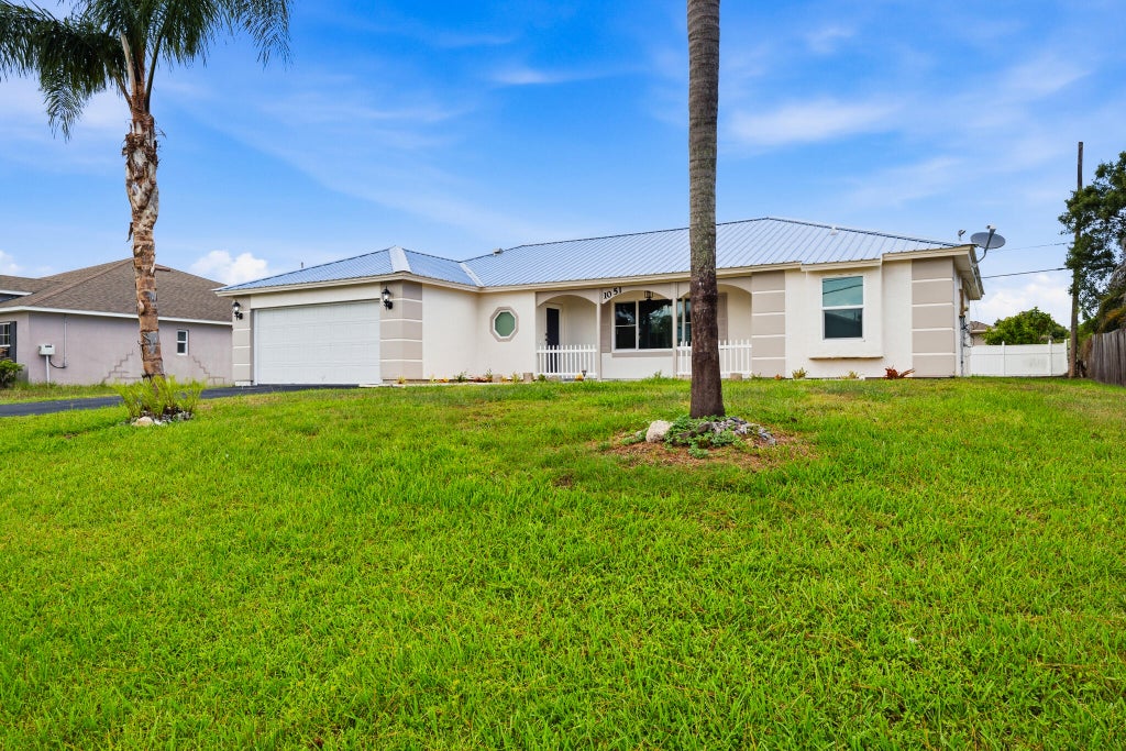 Photo of 1051 SW Dubois Avenue, Port Saint Lucie, FL 34953 (MLS # B26041936)