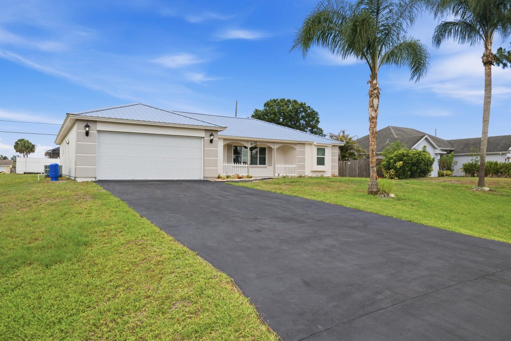 Photo of 1051 SW Dubois Avenue, Port Saint Lucie, FL 34953 (MLS # B26041936)