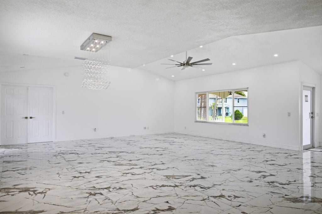 Photo of 1051 SW Dubois Avenue, Port Saint Lucie, FL 34953 (MLS # B26041936)