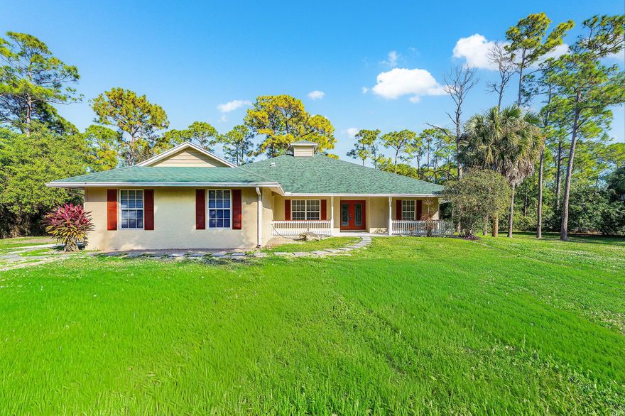 OVER SIZED LOT 1.34 ACRES. BEAUTIFUL 3/2 HOME. NEW ROOF 12/2025. TILE & LAMINATED FLOORING. LARGE SCREENED IN BACK PORCH & OPEN FRONT PORCH. OVER SIZED GARAGE. OPEN FLOOR PLAN WITH SPLIT BEDROOM.  QUIET COUNTRY LIVING.  CLOSE TO RESTAURANTS & SHOPPING. NO HOA