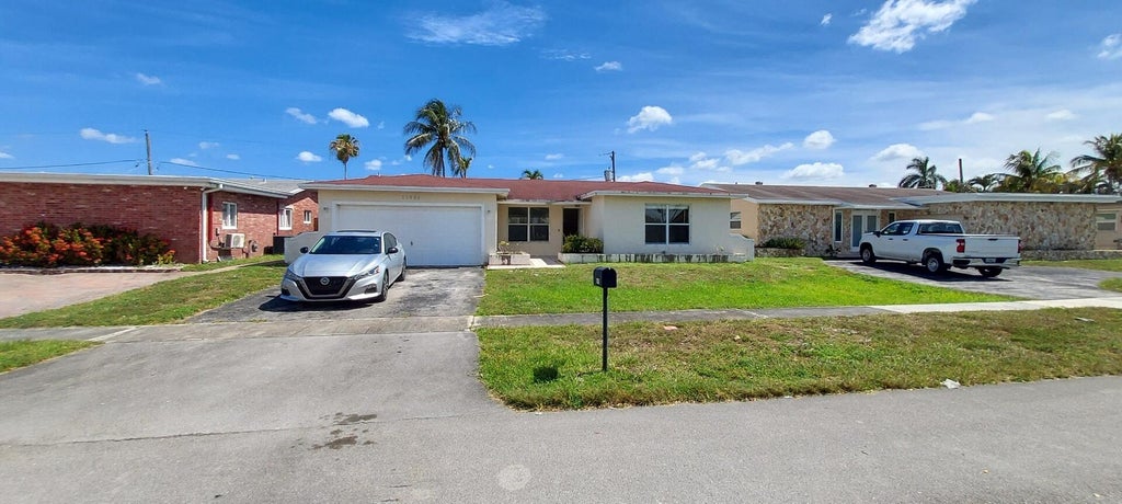 Photo of 11351 NW 40th Place, Sunrise, FL 33323 (MLS # B26045281)