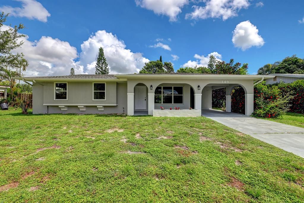 Photo of 149 NE Jardain Road Rd, Port Saint Lucie, FL 34983 (MLS # R10815385)