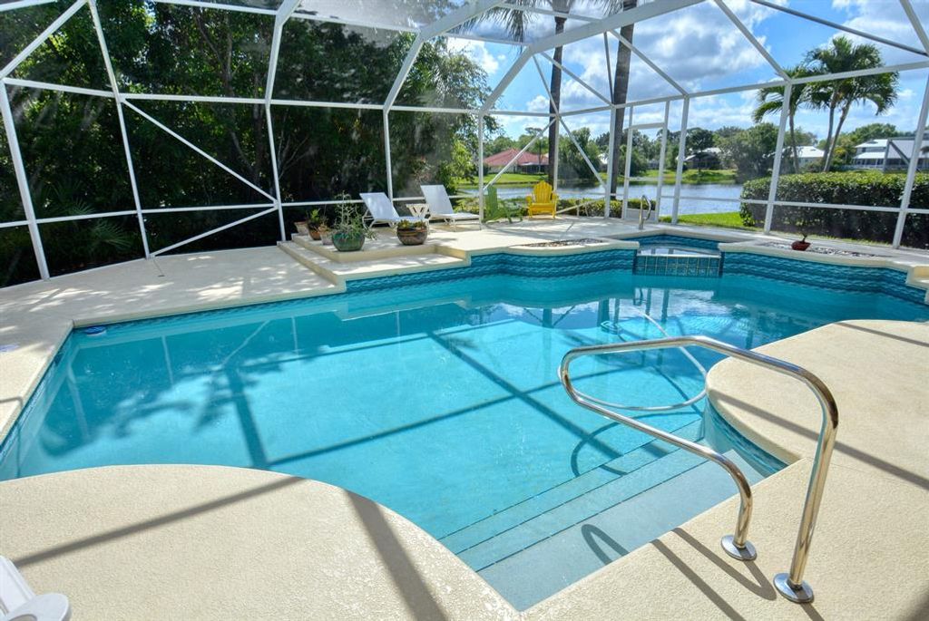 Photo of 1209 SW Lighthouse Drive, Palm City, FL 34990 (MLS # R10698052)
