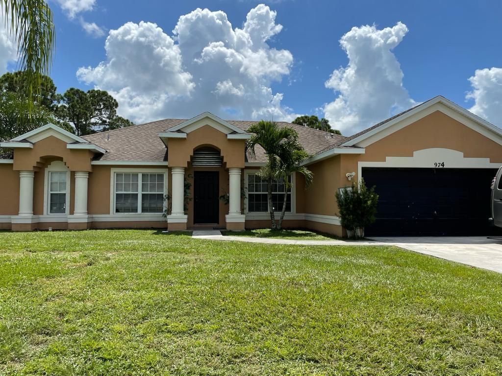 Photo of 974 SW California Boulevard, Port Saint Lucie, FL 34953 (MLS # R10743807)