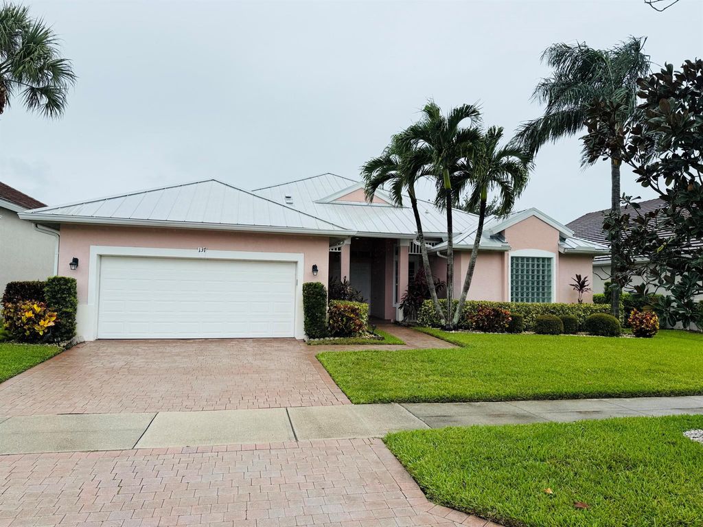 Photo of 137 NW Magnolia Lakes Boulevard, Port Saint Lucie, FL 34986 (MLS # R11024719)