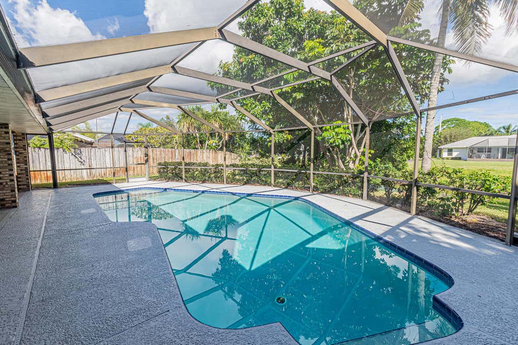 Photo of 409 SW Whitmore Drive, Port Saint Lucie, FL 34984 (MLS # R10976537)
