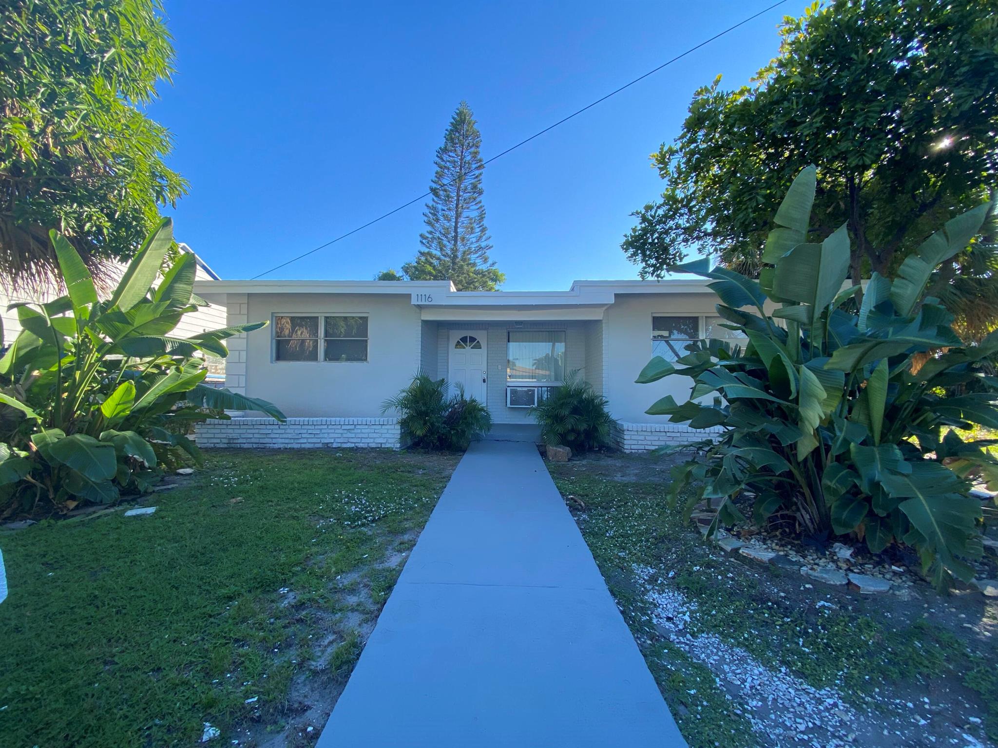 Located in a quiet neighborhood in West Palm Beach, this 4-bedroom and 2-bath home offers you comfort and convenience. Step inside and you will be greeted by a cozy living area and spacious bedrooms. Outside is a large backyard great for BBQ and entertaining. Washer and dryer in the unit. Conveniently situated near pristine beaches, world-class shopping, and dining destinations, this is Florida living at its finest. Fast and easy move-in process. Don't miss your chance. Schedule a property viewing today!