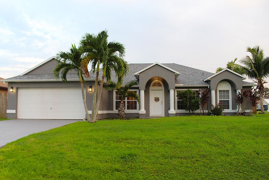 Photo of 1898 SW Penrose Avenue, Port Saint Lucie, FL 34953 (MLS # R11011122)