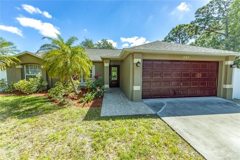 Photo of 1565 SW Hibiscus St, Port Saint Lucie, FL 34983 (MLS # F10329278)