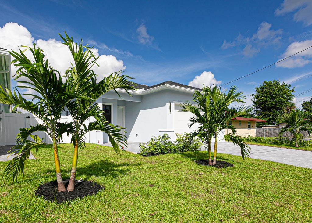 Photo of 2375 FAITH Avenue, West Palm Beach, FL 33417 (MLS # B26086039)
