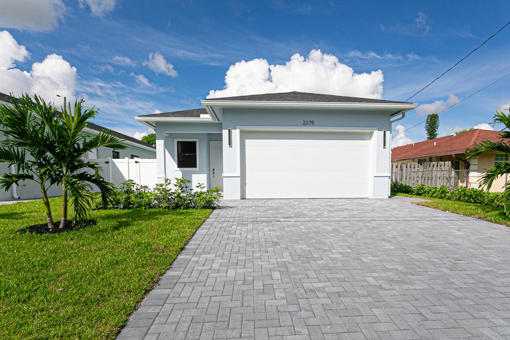 Photo of 2375 FAITH Avenue, West Palm Beach, FL 33417 (MLS # B26086039)