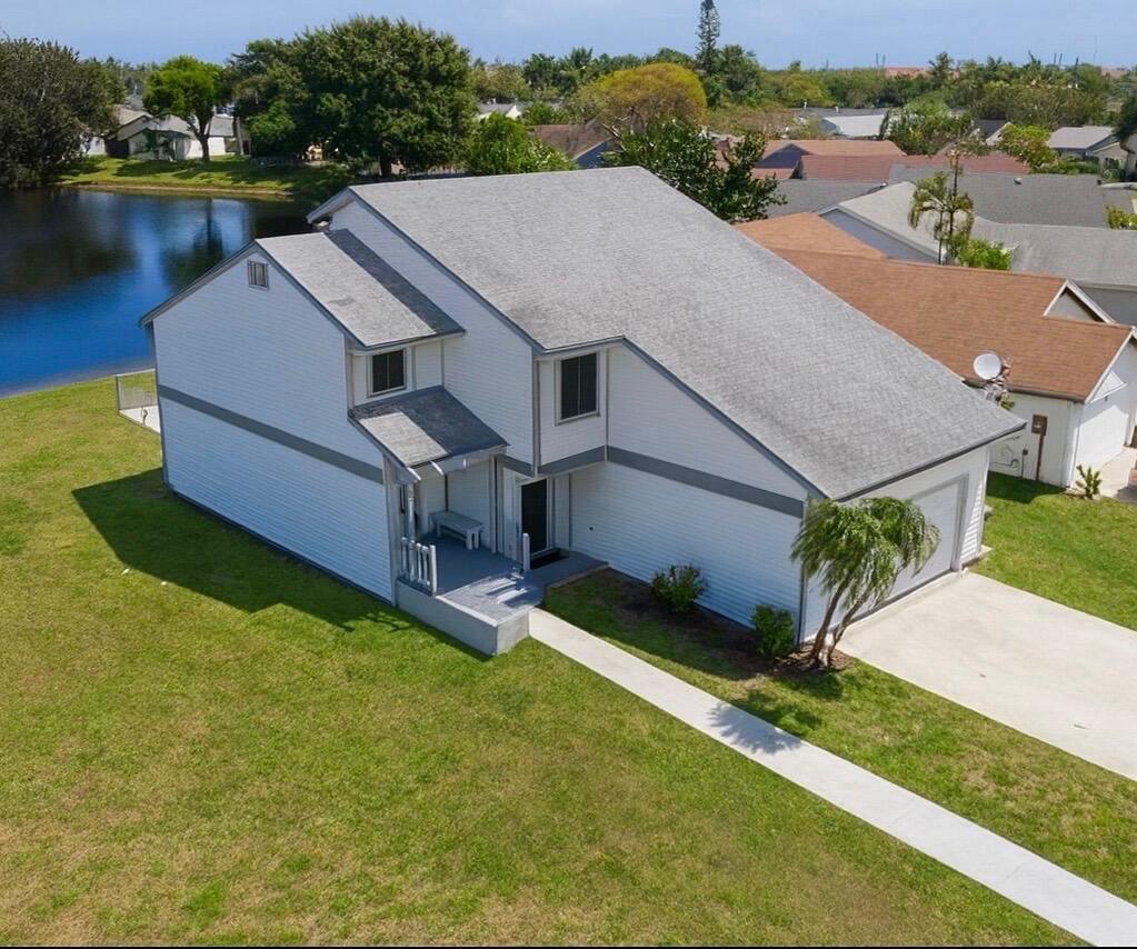 Beautiful 4BR/2.5BA single-family home with private pool overlooking a serene lake and surrounded by mature fruit trees. Enjoy peaceful water views from the screened patio or the master bedroom's private balcony. Home is equipped with working sauna, accordion shutters and offers great indoor/outdoor living. Spacious layout perfect for relaxing or entertaining. Conveniently located near Turnpike, I-95, and Downtown West Palm Beach. Community amenities include clubhouse, fitness center, party room, card room, billiards, tennis, racquetball, and playground, . Must see!