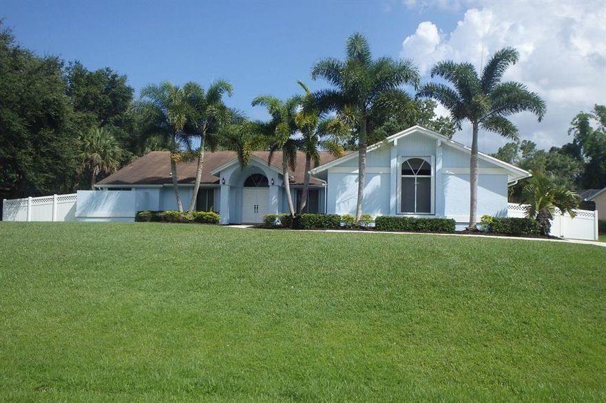 4 bedroom CBS smart home on an oversized half acre lakefront lot.You will love the spacious size of the rooms & open floor plan.The Home features beautiful new kitchen & bathrooms,vaulted ceilings, pocketing sliding glass doors to your outdoor living area,,separate secure fenced area for children or pets,full storm protection,Eat-in nook w/bay windows & French doors to the pool,separate dining area,split bedroom plan & home security system.The owner's suite features a walk-in closet w/extensive custom built-in shelving,vaulted ceiling, private access to stand up safe & access to the patio.Ensuite w/dual sinks, walk-in shower, natural light & separate tub. Maximize your entertaining on your lanai,with a sparkling screened solar heated pool, large covered patio equipped-wet bar & Cabana bath Fish in your back yard and create new memories in this beautiful Stuart home. One block from Phipps Park with ocean access no fixed bridges boat ramp, camping and a playground. Convenient access to Martin County's excellent schools, I-95, and shopping.