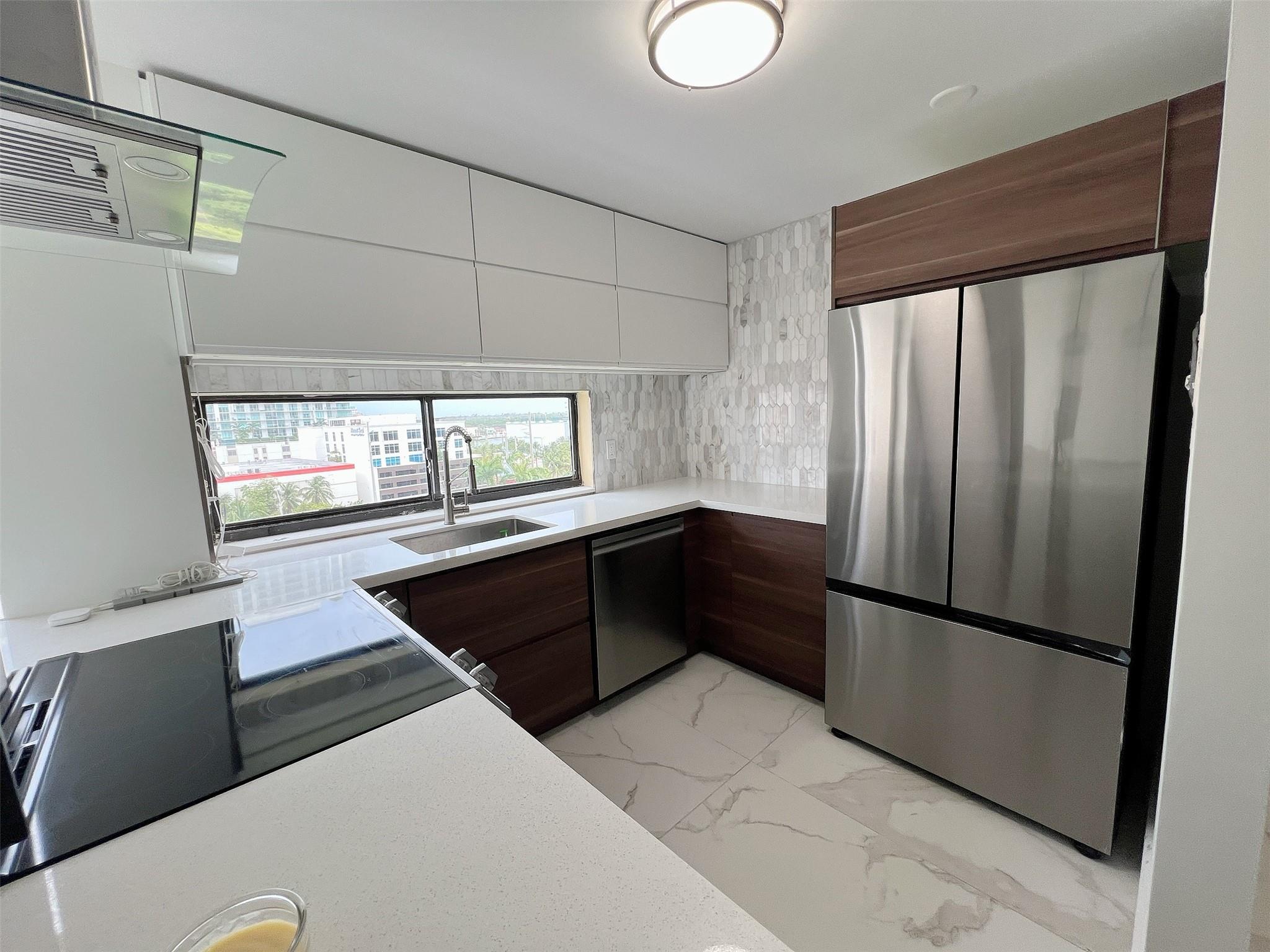 Location Location Location!!! Completely renovated 2/2 apartment. New tiles throughout, new kitchen, appliances, bathrooms, fans, doors, everything. Bright and airy unit in a quiet and well-maintained, gated community just a short walk from the ocean. Enjoy resort-style amenities: a huge heated pool, jacuzzi, sauna, gym, tennis courts, basketball court, library, party room, BBQ area, and 24/7 security. Conveniently located next to shopping plazas, restaurants, pharmacies, Milan's Supermarket, Starbucks, Marshalls, parks, A+ Schools and more. Just minutes from Aventura Mall and Bal Harbour Shops. Perfect as a primary residence, vacation home, or rental investment!