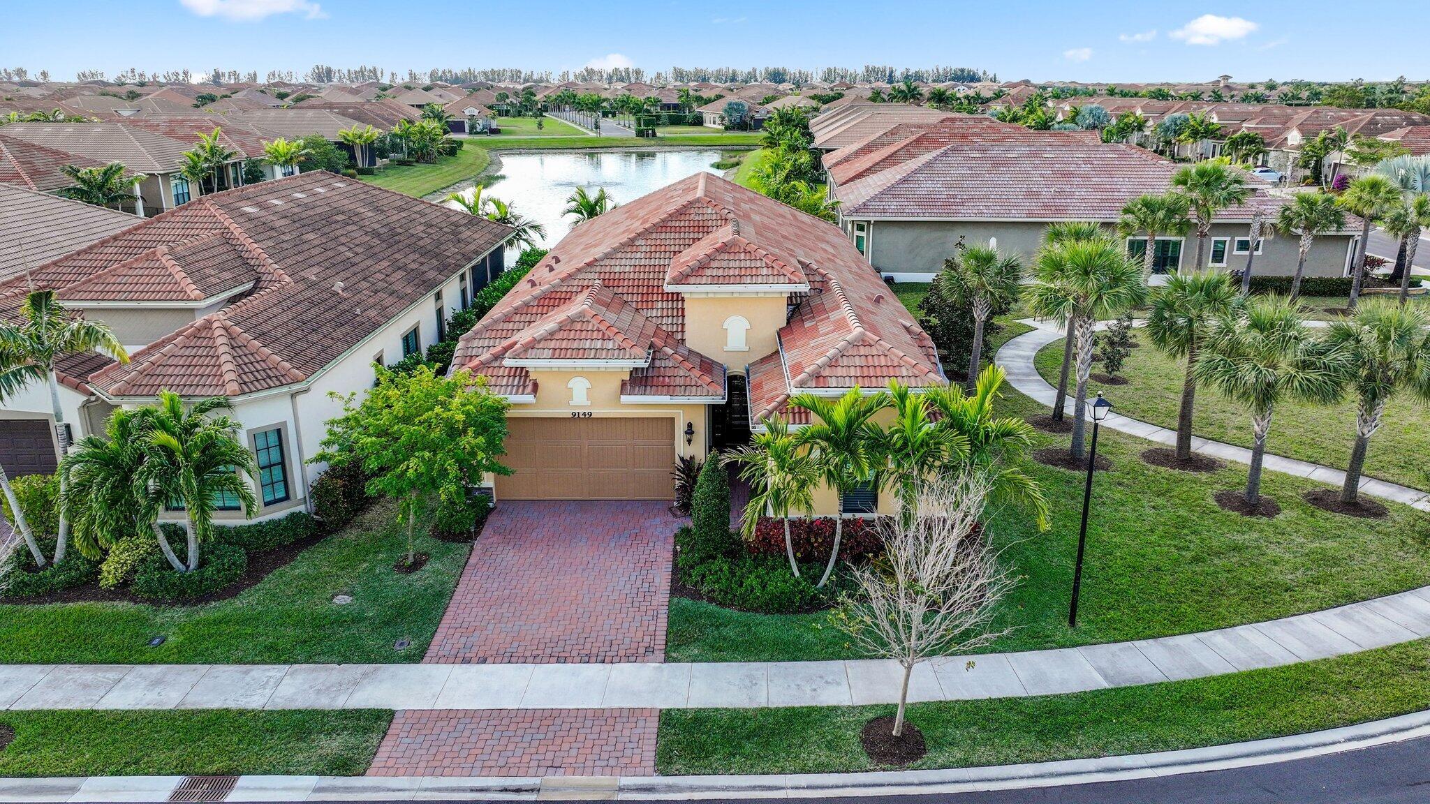 Discover the perfect blend of modern elegance and serene living at 9149 Leon Circle in Parkland, FL. This stunning home features 2 bedrooms and 3 bathrooms within 2,607 square feet of beautifully designed space. As you enter, you're immediately drawn to the fabulous long-range water view, complemented by wide open spaces and exquisite 36'' square white and grey marble porcelain flooring. The light and bright breakfast area offers a tranquil spot to start your day, with captivating views of the water. The gourmet kitchen is a chefs dream! Enjoy the privacy of an end lot with lush green space. The screened-in lanai provides a peaceful retreat, overlooking the water and its charming fountain. Situated on a 6,124 square foot lot, this home offers elegance and privacy in a picturesque setting.