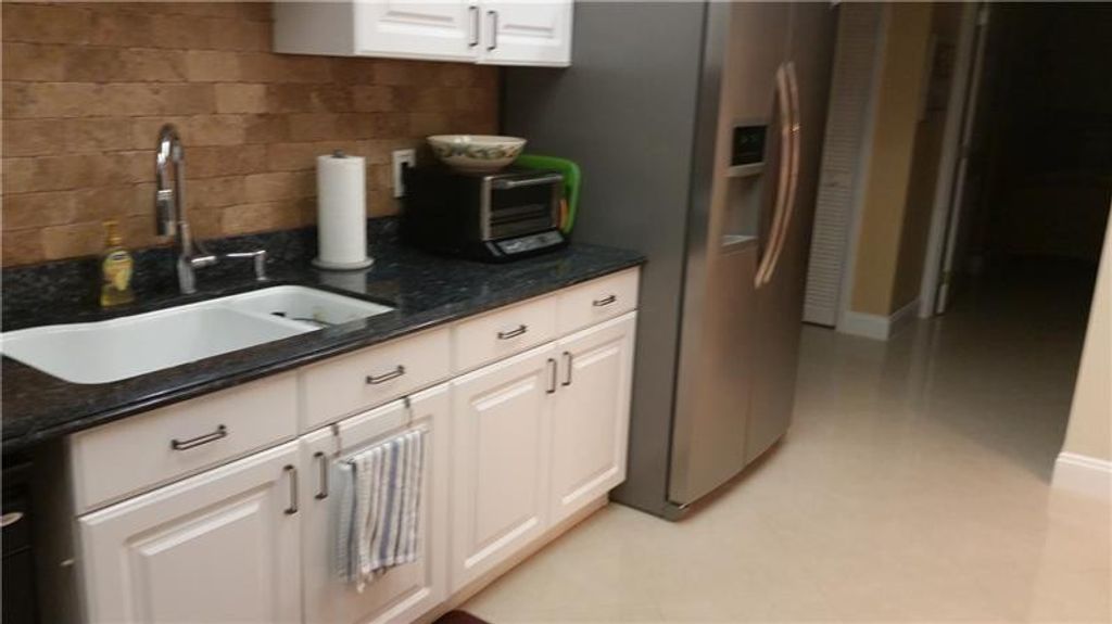 Photo of 625 Oaks Drive #704, Pompano Beach, FL 33069 (MLS # F10541461)