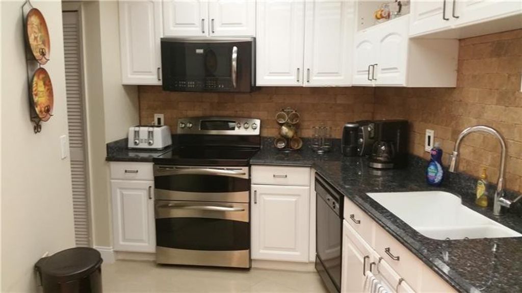 Photo of 625 Oaks Drive #704, Pompano Beach, FL 33069 (MLS # F10541461)