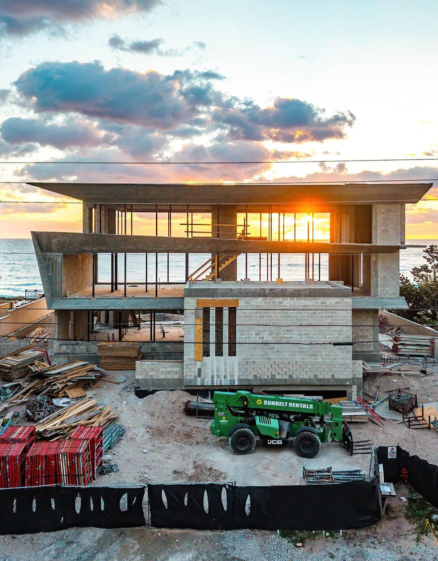 Experience unparalleled opulence in this new construction, oceanfront residence expertly crafted by Yodezeen Architectural and Design Studio in collaboration with J.Gregory Artistic Estates. This contemporary gem, located in Highland Beach, seamlessly blends cutting-edge earth tones with modern living amenities. Spanning four stories and 10,836 square feet, every room in this estate offers breathtaking views of the Atlantic Ocean. An elevated driveway allows parking on the entry-level. The home features a state-of-the-art chef's kitchen with temperature-controlled wine storage, a butler's prep kitchen, a private office, and laundry on each level. The entire second floor is dedicated to a lavish, 3000 sqft primary suite, offering ultimate privacy and luxury, complete with a massage room and a sleek gym. The third floor hosts additional ensuite guest rooms and a spacious loft area. Additional highlights including high-end appliances, a full smart home system, a 4+ car garage, a stunning pool, ample storage, and more. This home is the epitome of contemporary elegance and sophisticated coastal living.