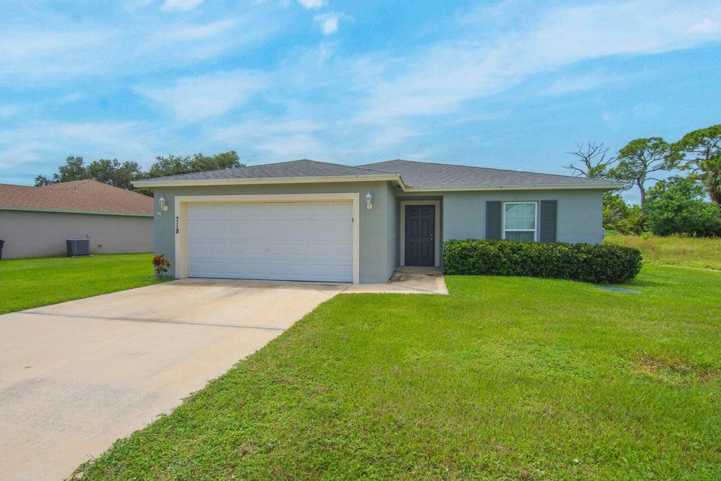 Photo of 718 NE PERCH Lane, Port Saint Lucie, FL 34983 (MLS # B26092694)