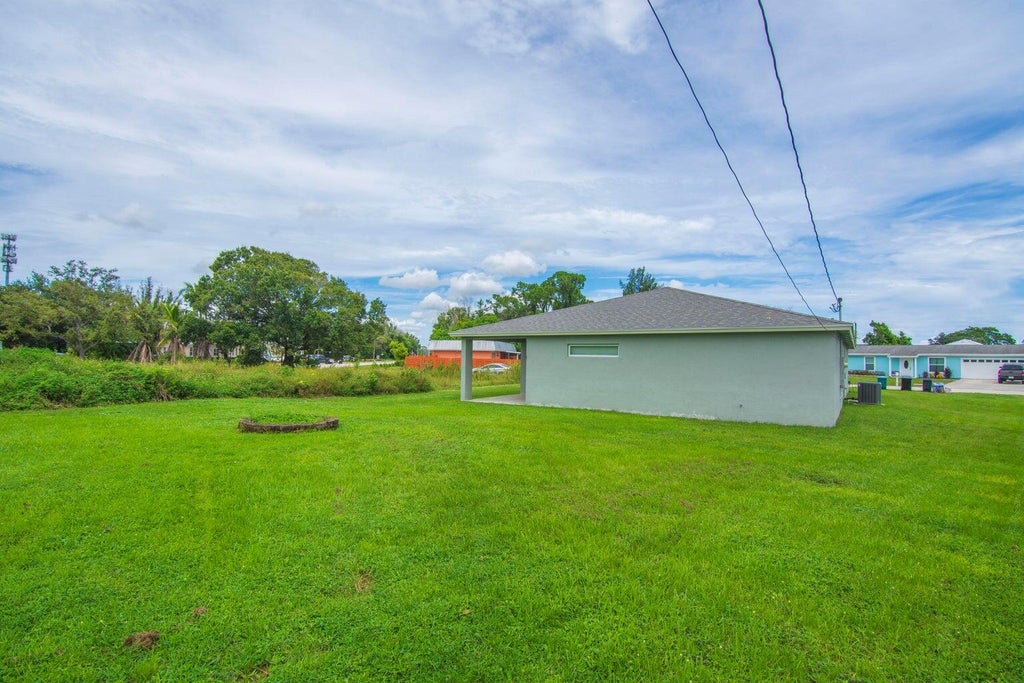 Photo of 718 NE PERCH Lane, Port Saint Lucie, FL 34983 (MLS # B26092694)