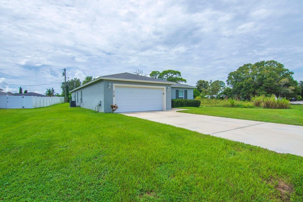 Photo of 718 NE PERCH Lane, Port Saint Lucie, FL 34983 (MLS # B26092694)