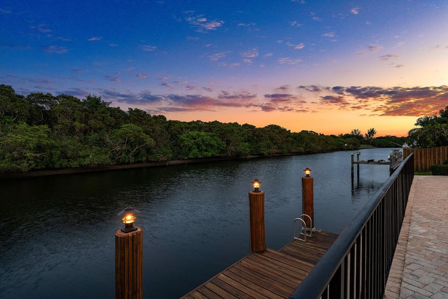 Rarely do you find a sanctuary that balances "boater's paradise" with total backyard privacy, but this Camino Lakes gem delivers both. Perched on a premier lot with 113' of water frontage, the view is a serene expanse of lush mangroves, not a neighbor's patio. Equipped with a 13k lb boat lift on a wide 120' canal, it offers seamless navigation and easy docking. The 4-bedroom home spans 3,100+ sq. ft. of light-filled living space with volume ceilings, open concept, and water views from nearly every room. Whether you're hosting a sunset dinner overlooking the mangroves or heading out to the Inlet, this home captures the quintessential Boca Raton lifestyle, offering total privacy just minutes from downtown Boca, the beach, and top-rated schools. The home has been meticulously updated for the modern buyer: 2024: A complete, spa-inspired Primary Suite bathroom remodel. 2022: A chef's kitchen overhaul featuring new appliances, plus a new Cabana bath and Jack-and-Jill bath. New Shaw luxury vinyl planking throughout for a seamless, coastal-chic aesthetic. PGT Impact Windows and a 2018 roof, the heavy lifting is already done. Water Heater (2021), dual AC units (2019/2021). Located in a coveted Camino Lakes neighborhood zoned for A-rated schools and walking distance to El Rio park featuring pickleball, tennis, basketball, playground, walking paths, BBQ grill pavilions and a kayak launching platform. A rare offering!