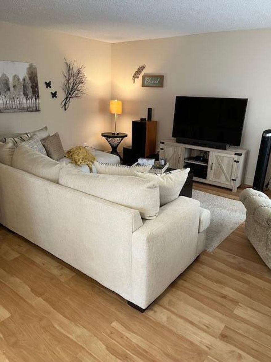 This 2-bedroom 2-bath condo has an enclosed screened porch.