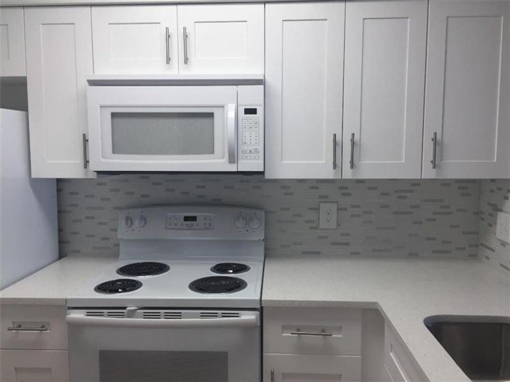 Photo of 2236 N Cypress Bend Drive #209, Pompano Beach, FL 33069 (MLS # F10405181)