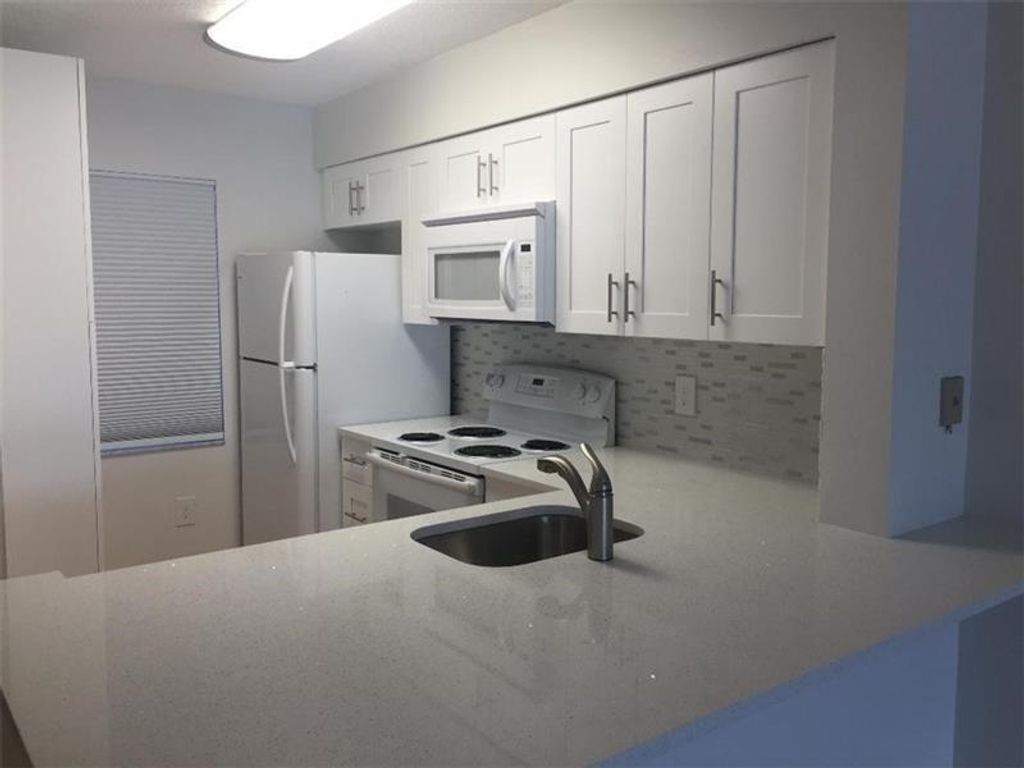 Photo of 2236 N Cypress Bend Drive #209, Pompano Beach, FL 33069 (MLS # F10405181)