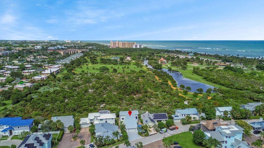 AVAILABLE FOR SEASON 2025! Just moments from the sparkling shoreline, this stunning 4-bedroom, 2-bath residence blends refined coastal style with contemporary design. Sun-filled spaces feature an open floor plan where large windows showcase serene pool views. A gourmet kitchen with premium appliances flows effortlessly into the inviting living area. The primary suite is a peaceful retreat, offering a spa-inspired bath and a private covered balcony. Three additional bedrooms provide flexibility for guests or family. Outdoors, a glistening pool is framed by vibrant landscaping and a spacious patio perfect for lounging, beachside strolls, or hosting elegant gatherings. This home embodies coastal living at its finest.