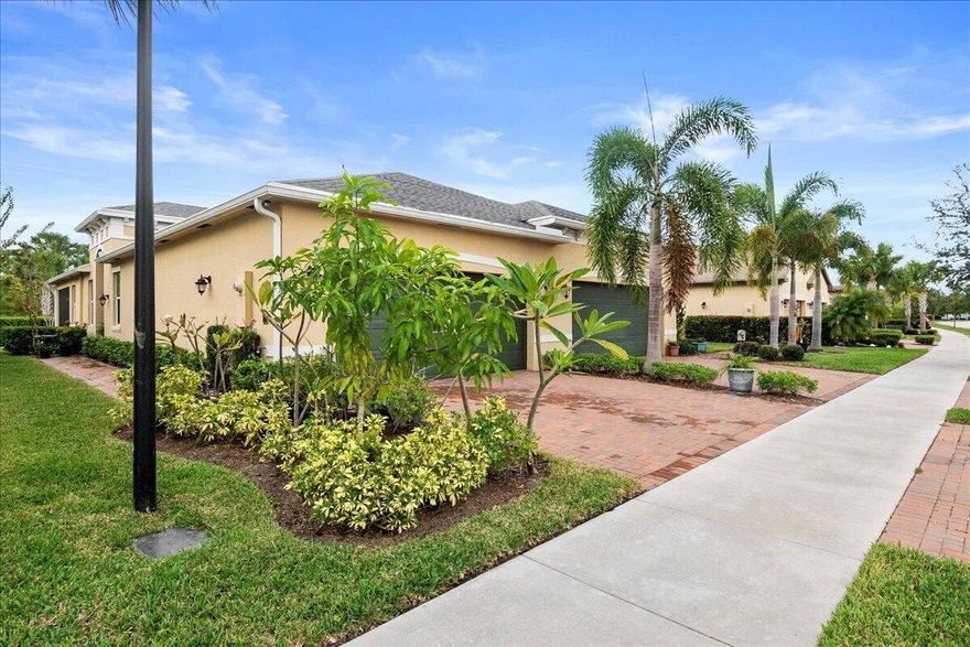 Experience effortless Florida living in this beautifully maintained, move-in ready 2-bedroom plus den, 2-bath villa with a 2-car garage, built in 2021 and located in the highly desirable 55+ community of LakePark at Tradition. This thoughtfully designed one-story home offers a bright, open-concept layout enhanced by tile flooring throughout for a clean, modern look and easy maintenance. The spacious kitchen is a true centerpiece, featuring stainless steel appliances, sleek quartz countertops, and abundant cabinetry, perfect for both everyday living and entertaining. It flows seamlessly into the dining and living areas, creating a warm and inviting space for gatherings or quiet evenings at home. A versatile den provides the flexibility to suit your lifestyle and is ideal as a home office, reading room, or additional bedroom. Impact windows throughout offer year-round peace of mind, energy efficiency, and added security. Step outside to your private covered and screened patio, where you can relax and enjoy Florida's beautiful weather in comfort and privacy. LakePark at Tradition offers a truly maintenance-free lifestyle, with HOA services that include cable TV, high-speed internet, alarm monitoring, landline phone, lawn care, and security. Residents enjoy access to exceptional resort-style amenities, including two clubhouses. The residents-only clubhouse features a state-of-the-art fitness center, resort-style pool with lap lanes, spa, cabanas, and a dog park. You'll also have full access to the TownPark Clubhouse with additional fitness facilities, pool, hot tub, tennis, pickleball, basketball courts, bocce, and more. Scenic sidewalks and trails connect it all, encouraging an active and social lifestyle. Ideally situated in the heart of Tradition, you're just minutes from top-tier shopping, dining, entertainment, and major highways. Whether you're searching for a full-time residence or a seasonal retreat, this villa offers the perfect blend of comfort, convenience, and community living. Opportunities like this don't last. Call now to schedule your private showing today and see it for yourself.