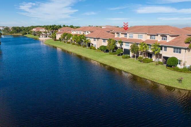 Walk to restaurants, gym, community pool and more from this upgraded townhome with water views and outdoor covered patio facing the lake. New stainless steel appliances and new washer and dryer and new A/C. 3 Bedrooms plus den, double depth garage and full length driveway with impact glass windows. Annual unfurnished rental available starting 8/15/23.