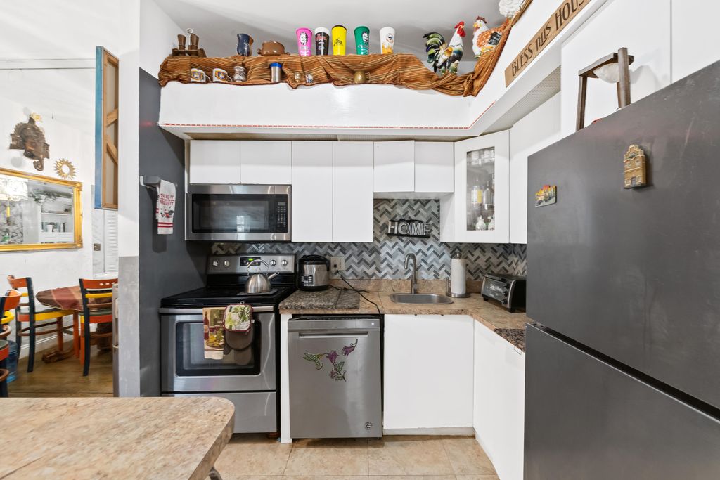 Photo of 10443 E Clairmont Circle #203, Tamarac, FL 33321 (MLS # B26013885)