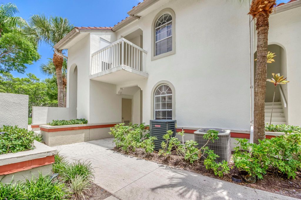 Photo of 106 Cypress Point Drive, Palm Beach Gardens, FL 33418 (MLS # R11106852)