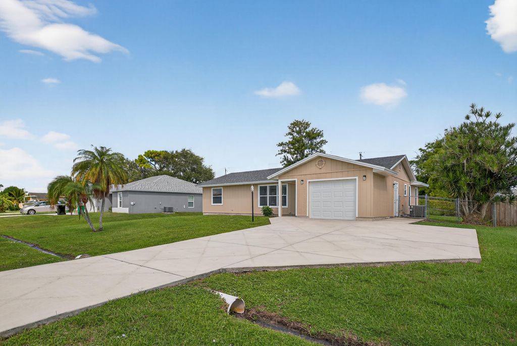 Photo of 2273 SE Melaleuca Boulevard, Port Saint Lucie, FL 34952 (MLS # B26007105)