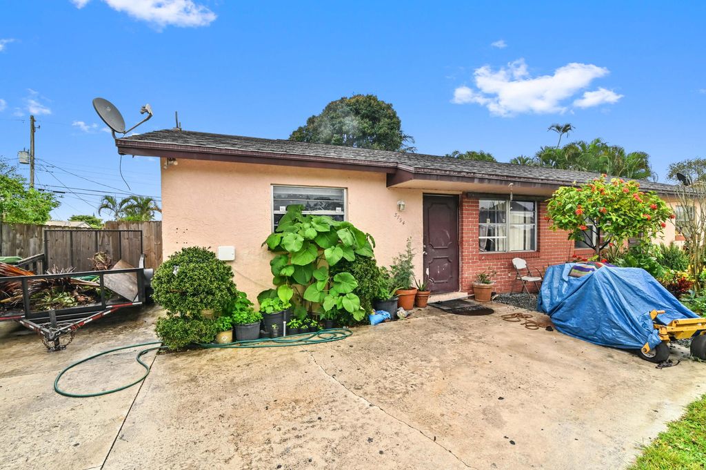 Photo of 3794 42nd Avenue S, Palm Springs, FL 33461 (MLS # R10966502)