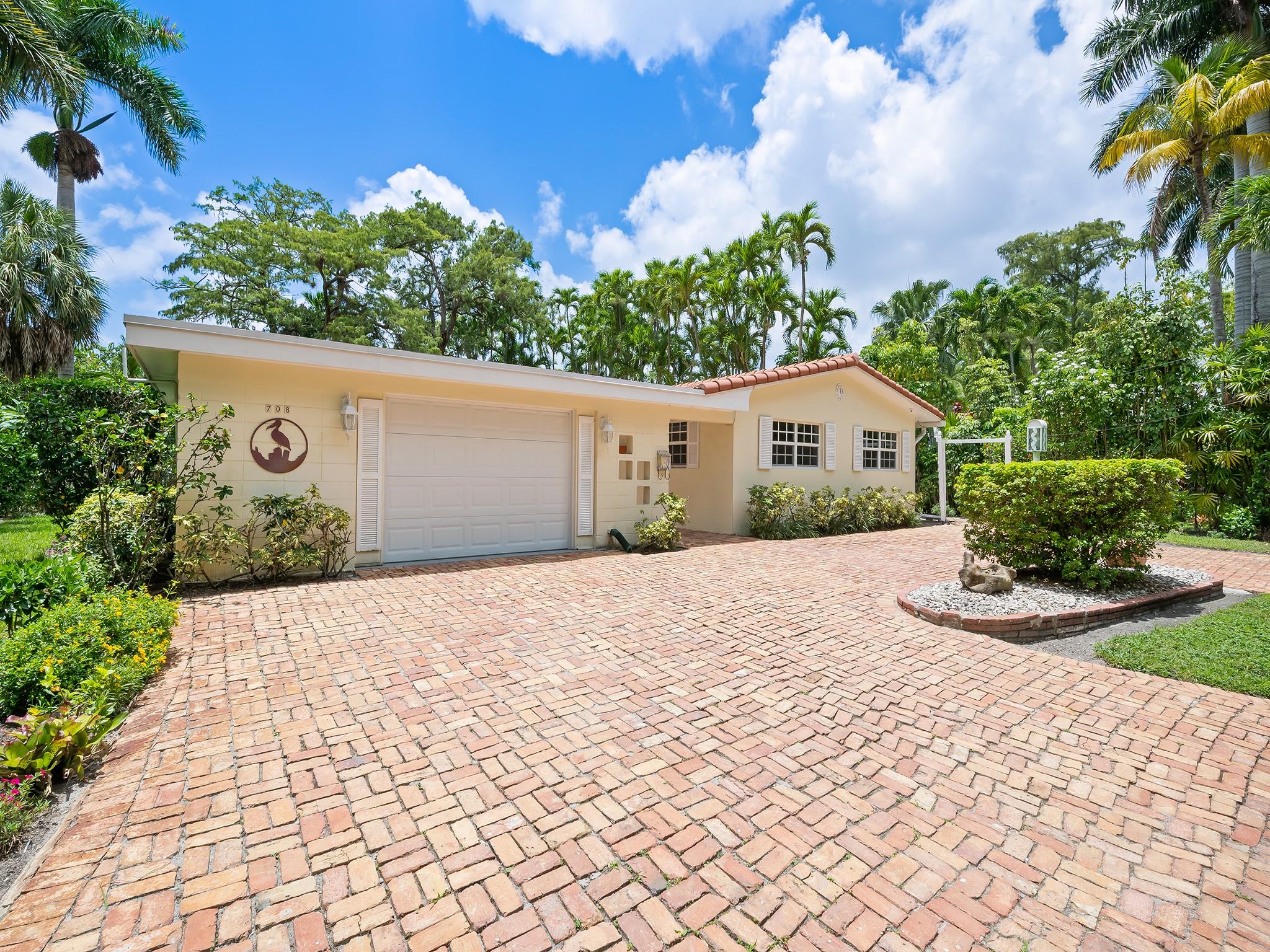 This waterfront home offers a perfect blend of Florida charm and modern updates, including a newer roof (2022) and impact windows and doors. Lovingly maintained by its original owner, this home is nestled on a serene canal-front lot at the end of a cul-de-sac. A brick-pavered circular drive provides a welcome entrance with ample parking for multiple vehicles, complemented by an oversized one-car garage. An expansive great room is filled with natural light and picturesque views of mature, shade-bearing trees and tranquil waters. With four bedrooms and three full baths, there's plenty of space for family and guests. The primary suite features an ensuite bath, while the layout ensures comfort and functionality. This one-of-a kind property offers endless potential in a truly special setting.