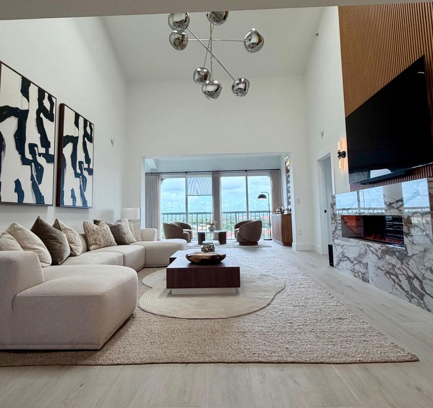 Stunning Penthouse just fully renovated including brand new bathrooms, new upscale appliances, wood floors and gorgeous upgrades throughout. Soaring 20 foot ceilings with views on both sides of the unit of the golf course and lake.  Luxury rental, absolutely must-see unit.  Offered fully furnished and move-in ready. Bonus room in unit includes office area as well as lounge seating.  Secure building - elevator only serves both Penthouse units.  Centrally located and close to highway access.