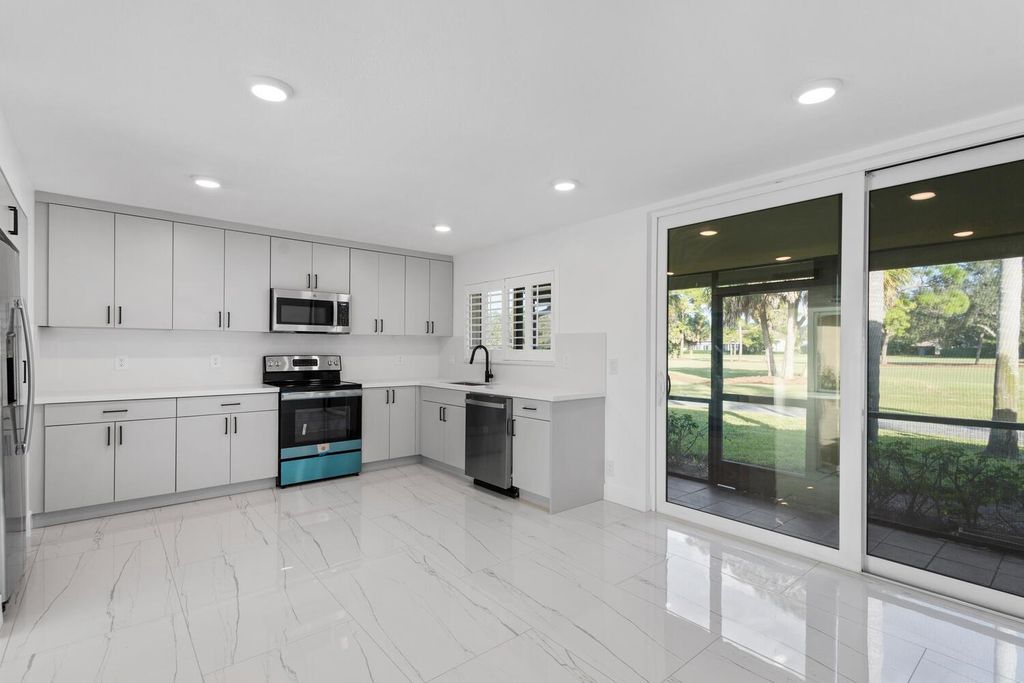 Photo of 215 Old Meadow Way, Palm Beach Gardens, FL 33418 (MLS # R10931954)