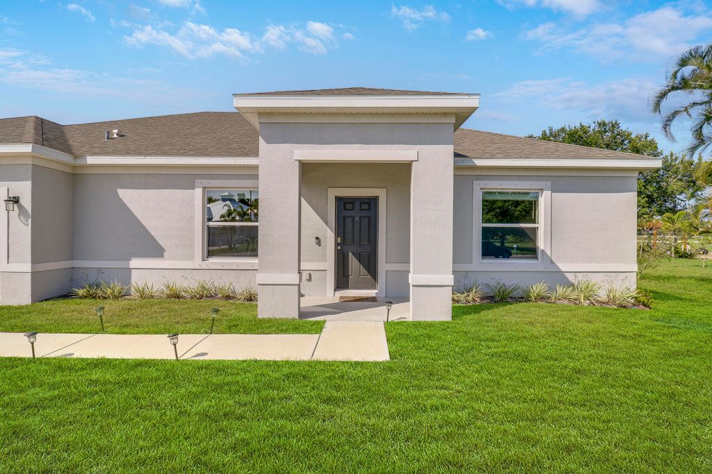 Photo of 1875 SE North Buttonwood Drive, Port Saint Lucie, FL 34952 (MLS # R10992196)