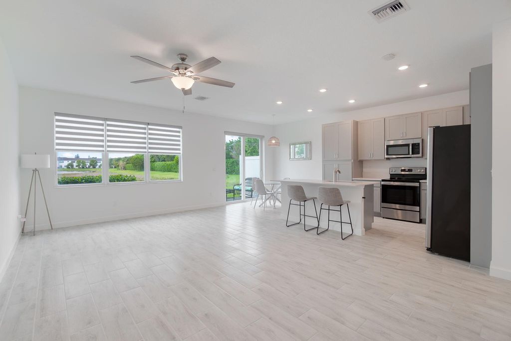 Photo of 5002 Navali Drive, Lake Worth, FL 33467 (MLS # B26006328)
