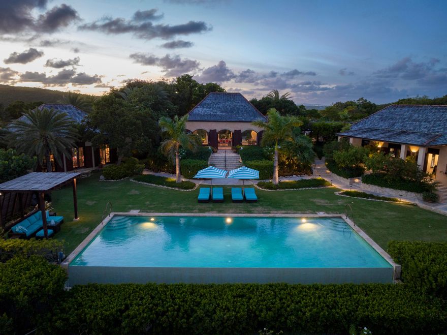 Perched 150 feet above sea level within the exclusive, members-only Mill Reef Club, Pelican Ridge emerges as one of the most remarkable properties currently available in the Caribbean. Designed by acclaimed architect Daniel Romualdez, this exceptional hilltop estate offers unmatched privacy, refined design, and sweeping views of Green Island, Neck Island, and York Island along Antigua's unspoiled southeastern coastline.

Set across 4 acres, the property features a beautifully executed 9,700-square-foot main residence with 4 bedrooms and 4.5 bathrooms, seamlessly blending timeless architecture with the island's natural beauty. Anchored by a spectacular infinity pool, the home embraces cooling easterly trade winds and frames uninterrupted vistas of the Caribbean Sea, culminating in unforgettable sunsets. 

Highlights include a luxurious master suite, three private guestrooms, a spacious living room with high ceilings, and a loggia with dining area. 

Pelican Ridge is one of those rare properties that captures the true spirit of Caribbean luxury -- elegant, effortless, and deeply connected to its natural surroundings. Its combination of architectural pedigree, privacy, and extraordinary views makes it an exceptional offering within Antigua's most coveted enclave.

A true sanctuary of design, exclusivity, and panoramic beauty, Pelican Ridge represents a once-in-a-generation opportunity to own a world-class property in one of Antigua's most prestigious locations.

DISCLAIMER: Information published or otherwise provided by the listing company and its representatives including but not limited to prices, measurements, square footages, lot sizes, calculations, statistics, and videos are deemed reliable but are not guaranteed and are subject to errors, omissions or changes without notice. All such information should be independently verified by any prospective purchaser or seller. Parties should perform their own due diligence to verify such information prior to a sale or listing. Listing company expressly disclaims any warranty or representation regarding such information. Prices published are either list price, sold price, and/or last asking price. The listing company participates in the Multiple Listing Service and IDX. The properties published as listed and sold are not necessarily exclusive to listing company and may be listed or have sold with other members of the Multiple Listing Service. Transactions where listing company represented both buyers and sellers are calculated as two sales. "No payments made until title passes" Some affiliations may not be applicable to certain geographic areas. If your property is currently listed with another broker, please disregard any solicitation for services. Information published or otherwise provided by seller, listing company or its representatives is deemed reliable but are not guaranteed and subject to errors, omissions, or changes without notice. Copyright 2026 by the listing company. All Rights Reserved.