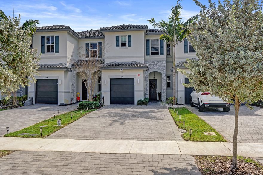 Welcome to Sunset Trails, a gated neighborhood offering full amenities and community events with low HOA fees and all A-rated schools! This newer construction townhome truly stands out with upgrades and improvements that go well beyond the builder's original finishes. Featuring full impact windows and doors for added peace of mind, the home is enhanced with luxury laminate wood flooring throughout, creating a seamless and modern feel. Natural light pours into the open living spaces, complemented by zebra automatic shades with remote controls for effortless style and convenience. The spacious bedrooms provide comfort and flexibility, with one room that has been thoughtfully redesigned into an unbelievable custom closet that any buyer will LOVE! The primary suite serves as a private retreat with stylish coffered ceiling, an additional walk-in closet and a spa-style ensuite bathroom. Step outside to your fully enclosed backyard oasis complete with ivy accent walls, retractable awning and contemporary outdoor furniture that is included in sale. This well appointed outdoor space is perfect for entertaining or unwinding in your own private setting. This residence also features an integrated camera security system, an attached garage plus an impressive six-car driveway offering rare and valuable parking space.This move-in-ready home combines modern design, premium upgrades and an exceptional lifestyle in one of the area's most desirable communities Sunset Trails, with resort-style community pool, tot lot and a vibrant calendar of events including outdoor movie nights, game nights, group walks along the neighborhood trails, community clean-up days, festive picnics and barbecues with food, music and fun providing a warm community feel nestled the best corner of Coral Springs. 

Coral Springs offers the perfect balance of peaceful suburban living and small town charm with the convenience of urban amenities, making it one of South Florida's most desirable areas to live with a variety of new development and hotspots popping up all over town offering new & trendy shops and dining spots like Tacocraft Taqueria & Tequila Bar, The Cook & The Cork, Eddie & Vinny's Coastal Italian just opened serving up innovative menus adding to a growing culinary scene as well as local long standing favorites Pizza Time, Big Bear Brewing Co and Bonefish Grill. The city is also home to cultural experiences such as the Coral Springs Center for the Arts, where residents can enjoy live performances, concerts and theater. There are also numerous parks and sports complexes, including the Betti Stradling Park, The Sportsplex at Coral Springs, home to the Florida Panthers Ice Den, offers an aquatic center, tennis courts and even a nature center. Enjoy being in close proximity to major area highways, public amenities, schools and more! Don't miss your opportunity to own this gem and experience the best of South Florida living. Schedule a showing today! **Please note select photos have been virtually staged to better showcase the true potential of the home. These photos are labeled ''Virtually Staged'' at bottom right.