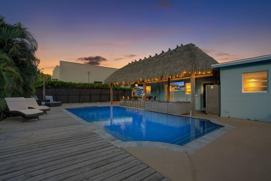 Discover your private tropical retreat in this 3 Bedroom, 2 Bathroom home in desirable East Oakland Park. The backyard offers a resort-style escape with a sparkling pool and an expansive tiki hut perfect for relaxing or entertaining. Inside, enjoy a bright open concept with a split floor plan for both flow and privacy. The kitchen and living areas connect seamlessly, complemented by a 2023 roof and interior laundry room. The primary suite opens directly to the backyard, while two additional bedrooms offer versatile use. A one-car garage provides added storage or potential flex space. Minutes to the beach, downtown Oakland Park, Wilton Drive, and top local dining this home blends comfort, style, and the South Florida lifestyle.