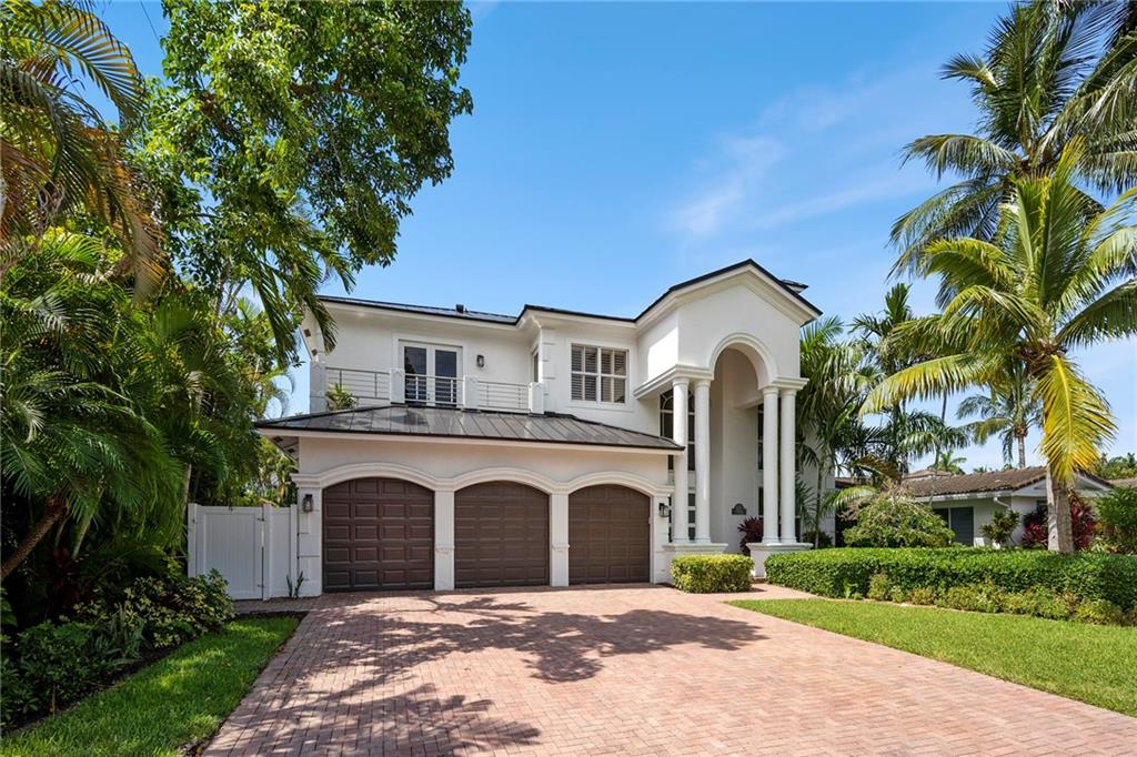 Welcome Home to Coastal Lake Placid Lighthouse Point! This 2 Story Home Features: 5 bed, 5 bath w/3 CAR GARAGE, TROPICAL FULLY FENCED private lot w/ heated pool, Hurricane Impact windows & doors, volume ceilings, fireplace, plantation shutters, brand new kitchen, stainless Jenn Aire appliances, pantry & wine cooler, 48"porcelin floors on 1st level & wood floors upstairs, custom stairwell, banisters, light fixtures. Double doors welcome you into the spacious Master Upstairs, 2 WIC w/ built-ins, frameless walk-in shower w euro drain, free standing tub & double vanities. Backyard has nice covered patio, pool, spa, cabana bath, outdoor shower & grass space. Full bedroom w/ en suite on 1st floor. Walk to Frank MacDougal Park & Tennis Center!