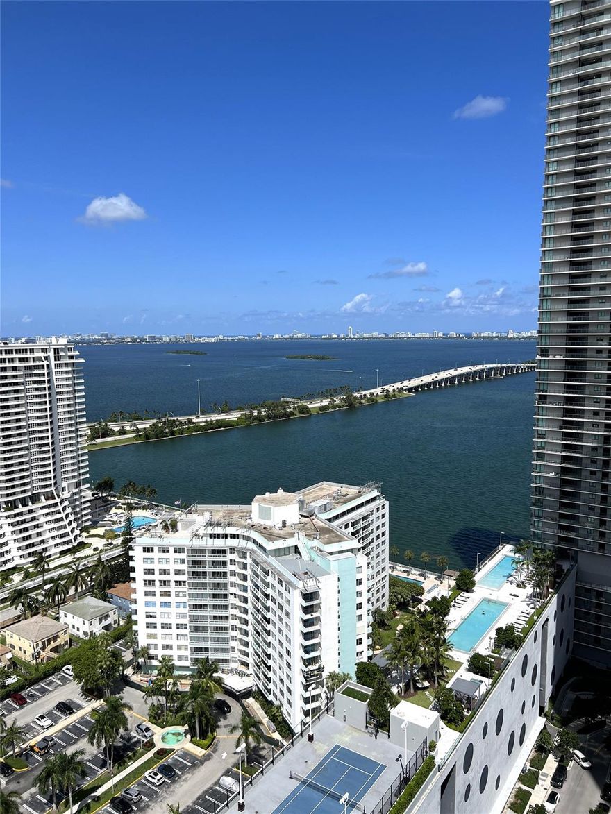 Amazing, spacious, meticulously finished 3 bedroom, 2 bathroom corner unit at Paraiso Bayviews! Interiors by Karim Rashid! Enjoy walking in to wide open bay views. White marble flooring, automatic Hunter Douglas blinds, and nicely finished closets with no details spared. Pet friendly. Fast approval. Spend afternoons at the happy hour at Paraiso Beach Club or Amara at Paraiso, one of Michael Schwartzs gems. Amazing building with rooftop and 5th level pools with BBQ areas, tennis court, gym, spa, kids playroom, concierge, pool table and theater room, and other amenities!