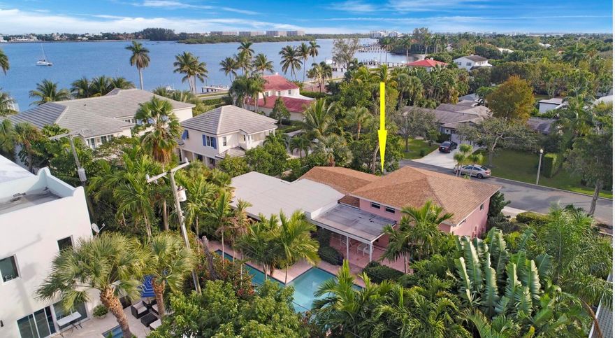 SUPERB LOCATION! 2nd home off Flagler Dr., from IntraCoastal Waterway, offering ELEVATED LOT, surrounded by Luxury Homes, & within A+ School Districts! Beautiful 3 bedroom 3 Bath POOL HOME with Den for all your family needs! Fantastic Open Floor Plan with loads of Natural light! Mexican Tile and Hardwood Floors compliment this Freshly Painted Split Level Home. Enjoy dinner in the Screened Lanai, off of the Fireplaced Living Room or Dine Al Fresco under the covered Patio overlooking Pool! Outdoor Living at its BEST, with extended Brick Patio for Sun Bathing and PRIVATE Expansive Pool Area! Build your DREAM HOME in this coveted location, or enjoy home in present condition.